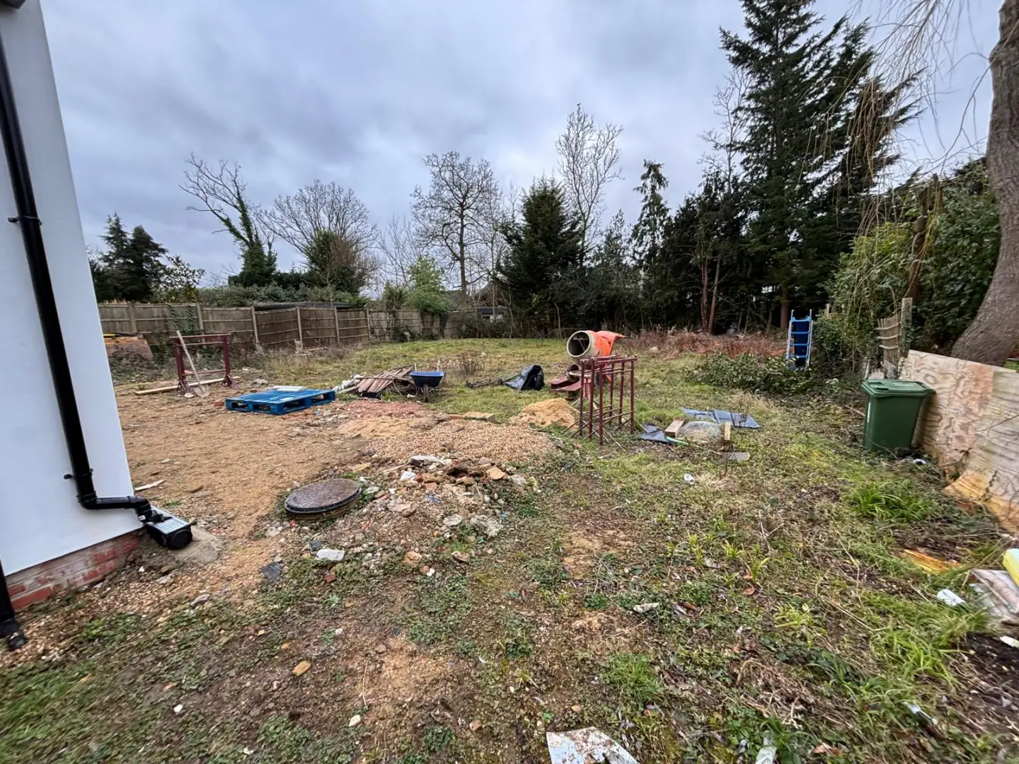 Site set up and initial groundworks underway across the full width of the garden