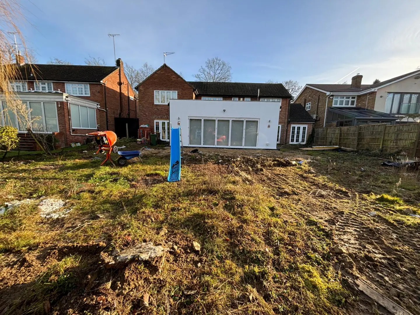 Early clearance stage as groundworks begin across the rear outdoor space