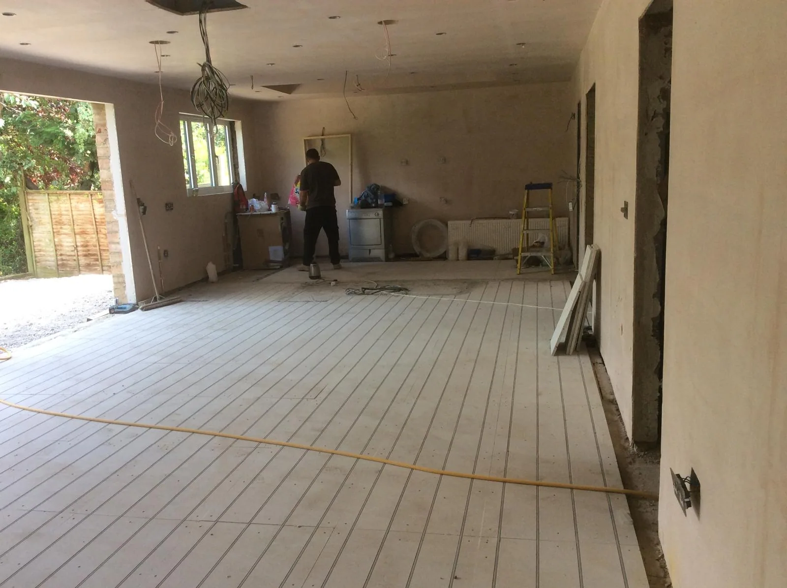 Roof framing, dormer construction, and weatherproofing on site