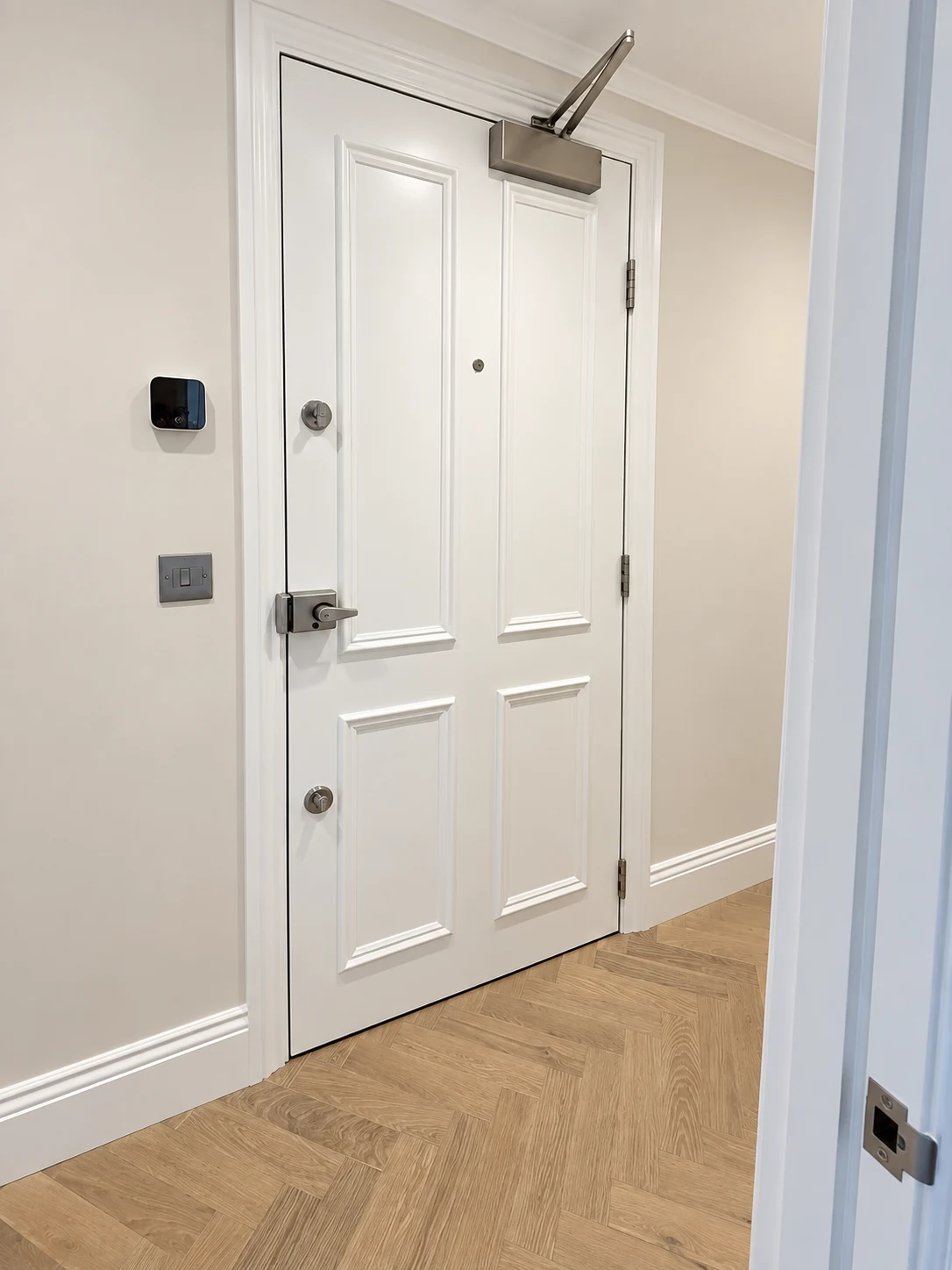 Clean white internal doorway framing sightlines across renovated rooms