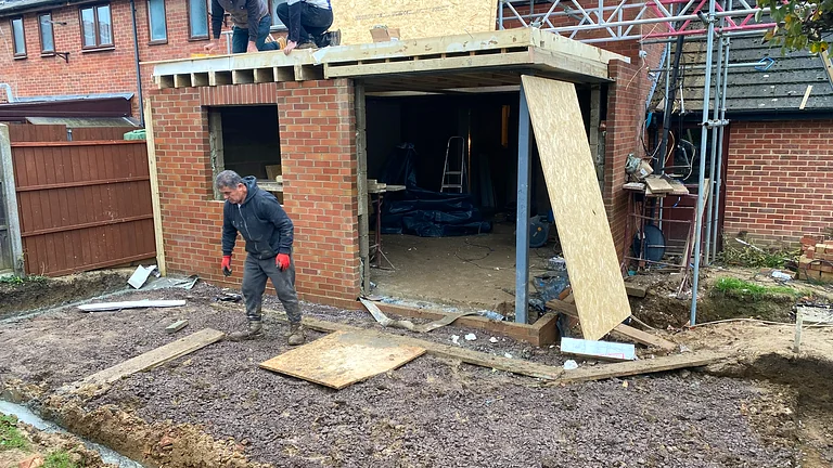 Architectural glazing installation with flush threshold detail on extension