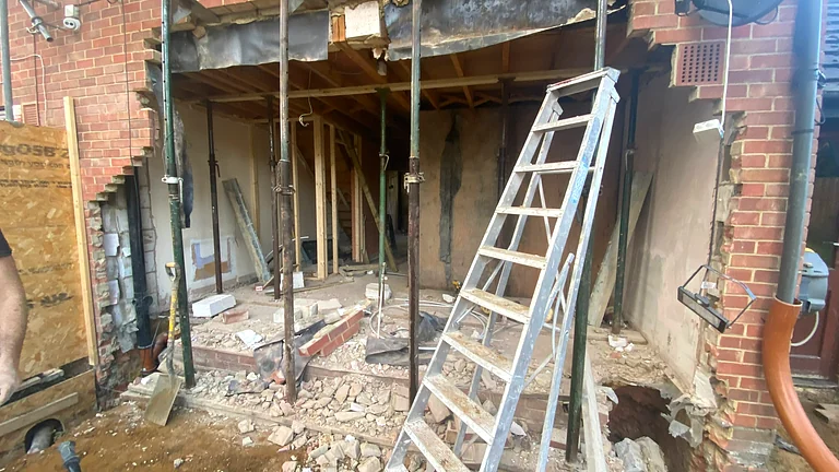 Load-bearing wall knock-through with structural steel beams in Highgate