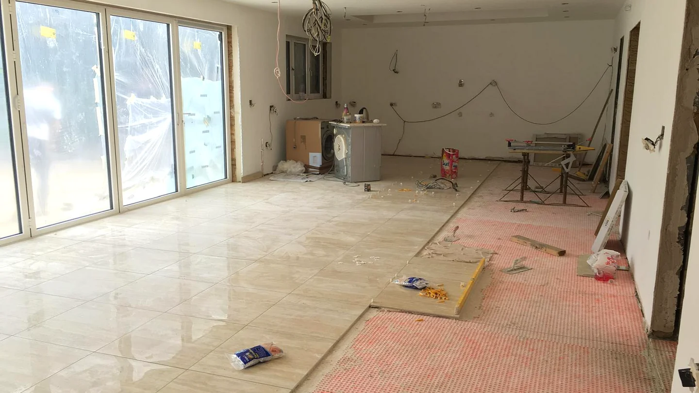 Water underfloor heating screed and laser-aligned 1200x600 porcelain floor tiling in Brookmans Park AL9, South Hertfordshire