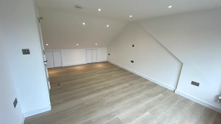 Spacious hip to gable loft conversion bedroom in Winchmore Hill